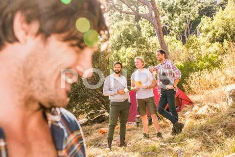 Close Up Of Man Camping With Friends In Forest, Deer Park, Cape Town, South