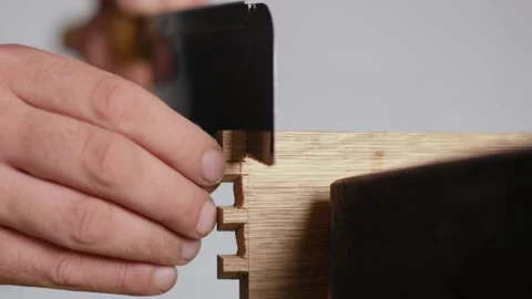Close up. a man carves a dovetail joint on an oak board with a Japanese hand  Stock Footage 144244637