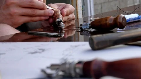 Close up man carving wooden pattern at work space Stock Footage 113912770