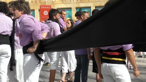 Close man castle-maker wraps wide black belt around waist Stock Footage 103299580