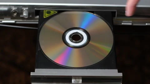 Close up of Man Changing Disks in DVD Player Stock Footage 151590857