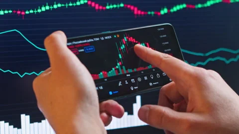 Close-up, man checking Bitcoin price chart on digital exchange on smartphone Stock Footage 262801617