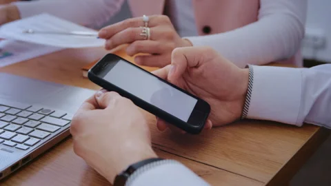 Close Up of Man Checking Financial Information on Mobile App Stock Footage 339608127