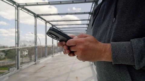 Close-Up Of Man Checking Phone At Sunset - Urban Cinematic Lifestyle Video stock 309476557