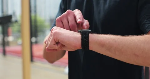 Close up man checking results on smartwatch after training. Healthy lifestyle Stock Footage 246366695