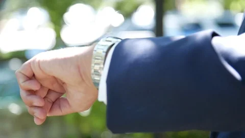 Close up of man checking watch for time 스톡 동영상 111400629