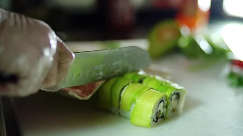 Close-up of man chef hands cutting with knife a traditional Japanese food Video stock 106389112