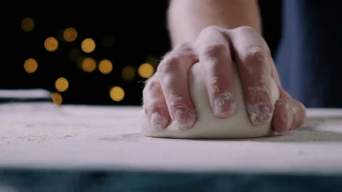 Close-up of man chef hands making a pizza dough ball Video stock 132815528