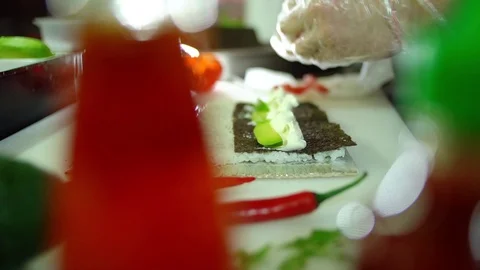 Close up of man chef make homemade sushi and rolls Video stock 106389216