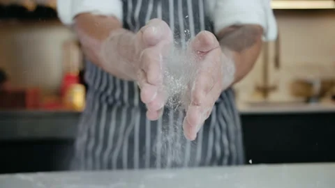 Close-up Man Chef at Restaurant Kitchen Clapping Hands with Flour Cooking Bakery Stock-Footage 142634672