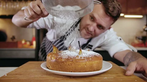 Close-up Man Chef at Restaurant Kitchen Serves Dish Adding Ingredient by Hand Video stock 142635842