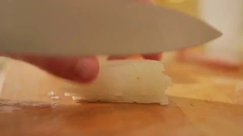 Close-up of a man chopping a bow with a knife Stock Footage 81432073