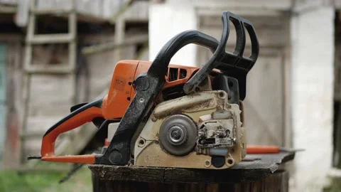 Close-up Man Cleans A Contaminated Chainsaw With A Brush After Work Video stock 131313388