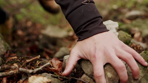 Close-up of man climbing on a difficult trail hike in the mountains slow-motion. Stock Footage 234553541
