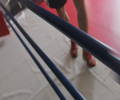 Close up of man climbing over rope and entering boxing ring, Japan Stock Footage 147043769