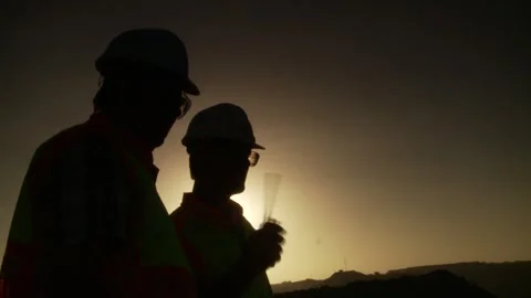 A Close-up of a man communicating on an opencast mine Stock Footage 312400407