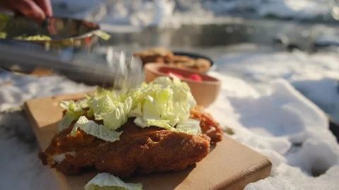Close up of man cooking delicious schnitzel caesar salad with chicken meat, eggs Stock Footage 301076529