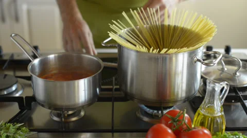Close up man cooking spaghetti and tomato sauce in the kitchen close up Stock Footage 38569888