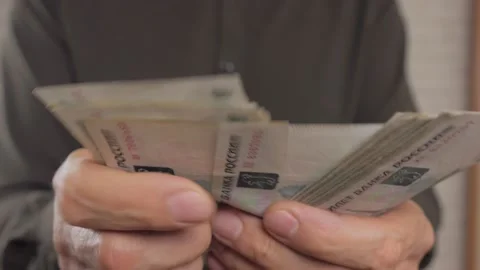 Close-up, a man is counting banknotes in rubles. Unrecognizable person. Stock Footage 165433241