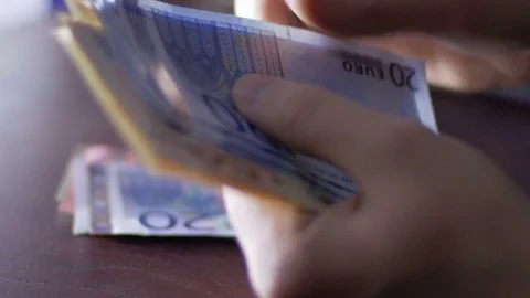 Close-up of man counting a illegal money indoors Stock Footage 75460867