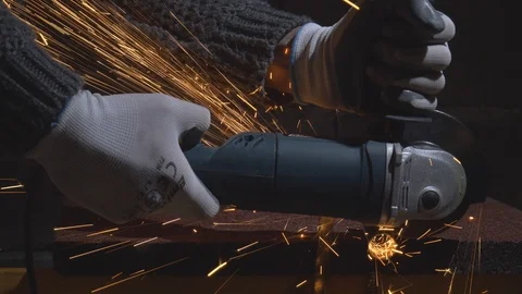 Close up of man cuts iron pipe Stock Footage