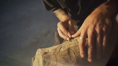 Close up man cuts out a beautiful pattern on wood rapid slow motion Stock Footage 81061153