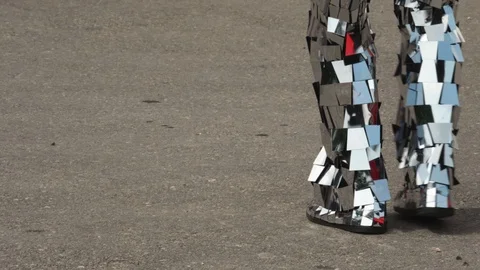 Close-up of a man dancing in a shiny disco robot costume made of mirrors Stock Footage 119522700
