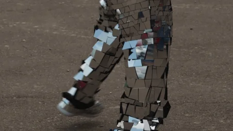 Close-up of a man dancing in a shiny disco robot costume made of mirrors Video stock 119522835