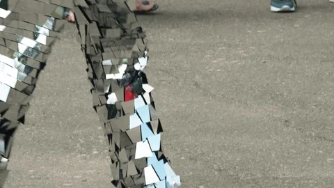 Close-up of a man dancing in a shiny disco robot costume made of mirrors Video stock 119522961