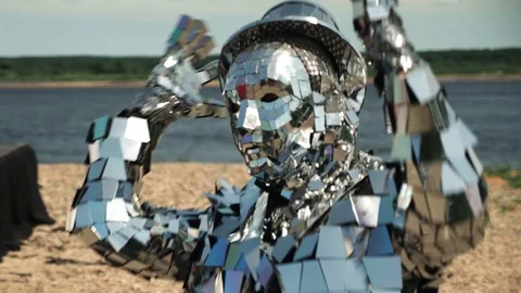 Close-up of a man dancing in a shiny disco robot costume made of mirrors Stock Footage 119523068
