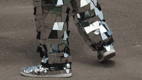 Close-up of a man dancing in a shiny disco robot costume made of mirrors Stock Footage 119523203