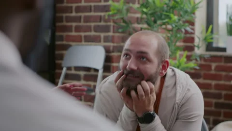 Close up of man dealing with anger management issues in front of people at aa Stock Footage 165144802