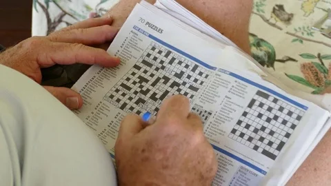 Close Up Man Doing A Crossword 스톡 동영상 77275297