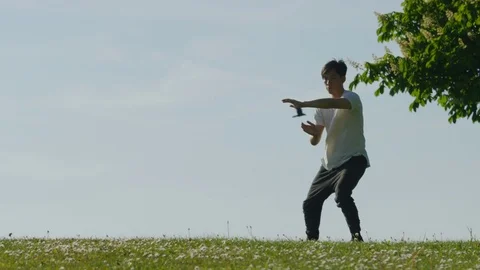 Close up of man doing tai chi outdoors in the countryside Video stock 75555070