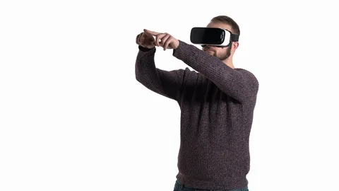 Close-up of a man drawing imaginary square in the air while wearing modern VR Stock Footage 121200566