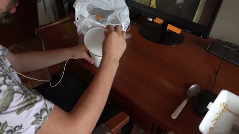 Close-up of a man drinking chifa soup, a typical Peruvian fast food Stock Footage 149194114