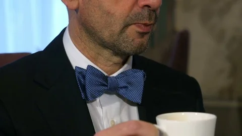 Close up, man drinking coffee at restaurant Stock Footage 85349218