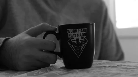 A close up of a man drinking cup of tea or cup of coffee in a mug Stock Footage 155127378
