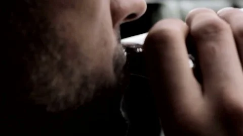 Close up of man drinking from hip-flask in retro style. FULL HD Stock Footage 82650496