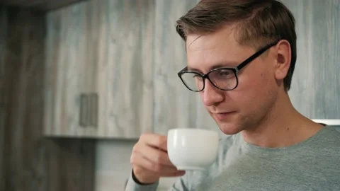 Close up of a man that is drinking hot strong coffee while take a break from Stock Footage 145122191