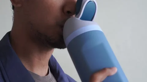 Close Up man drinking water bottle after workout training Stock Footage 328646440
