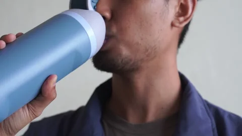 Close Up man drinking water bottle after workout training Stock Footage 328646441