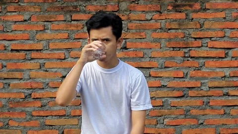 Close up of man drinking water from glass Stock Footage 312081381