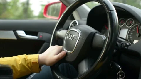 Close-up Of a Man Driver's Hand On Steering Wheel of a Car Audi Stock Footage 130652507