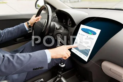 Close Up Of Man Driving Car With Chart On Screen