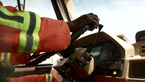 Close-up of man driving a construction vehicle Stock Footage 312400415