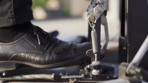 Close-up of man drummer leg in black shoes hitting bass drum with pedal Stock Footage 242428796