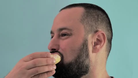 Close-up of a man eating donuts Stock Footage 243674860