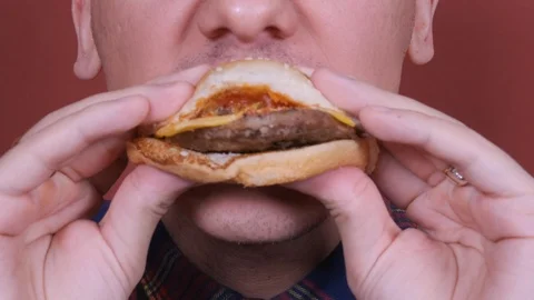 Close up. man eating hamburger Stock Footage 122806104