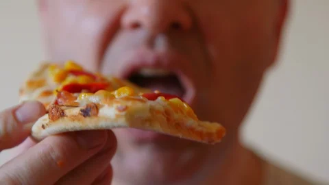 Close up of man eating pizza. Man eating unhealthy food. Macro shot of ugly m Stock Footage 129339488